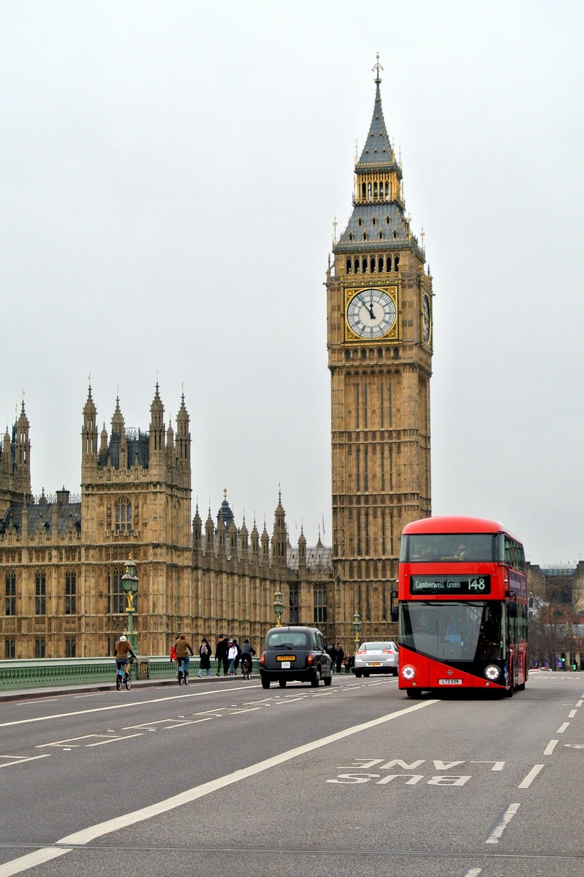 Big Ben and a red double-decker bus in London, the seat of UK Parliament