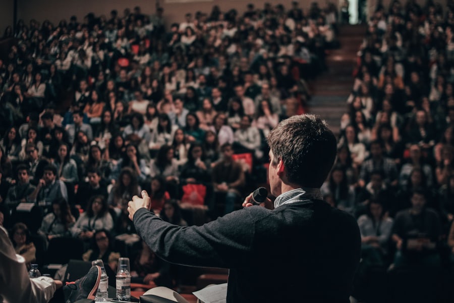 Speaker addressing a young audience at a Parliament Revealed event